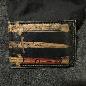 Older Leather Bi-Fold Wallet with Knife Print